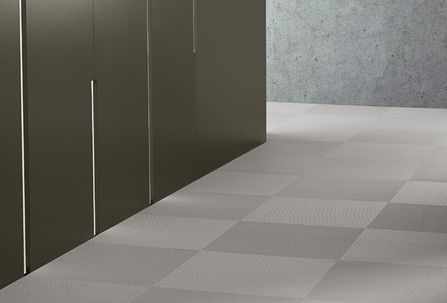 Interwoven vinyl tiles